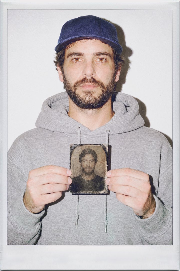 TinType, front: a man holding a tintype plate of his own portrait
