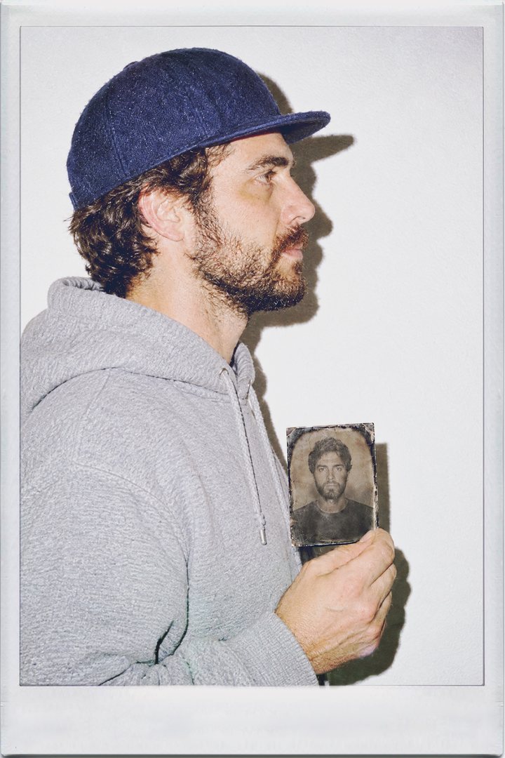 TinType, profile: a man holding a tintype plate of his own portrait