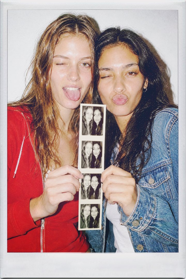IncrediBooth, front: two friends holding up a photo booth strip