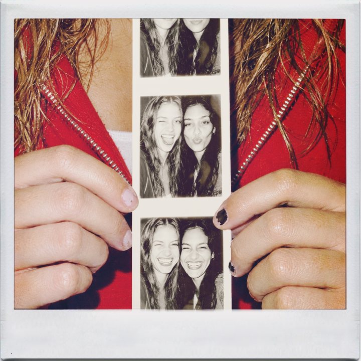 IncrediBooth, hands: two friends holding up a photo booth strip